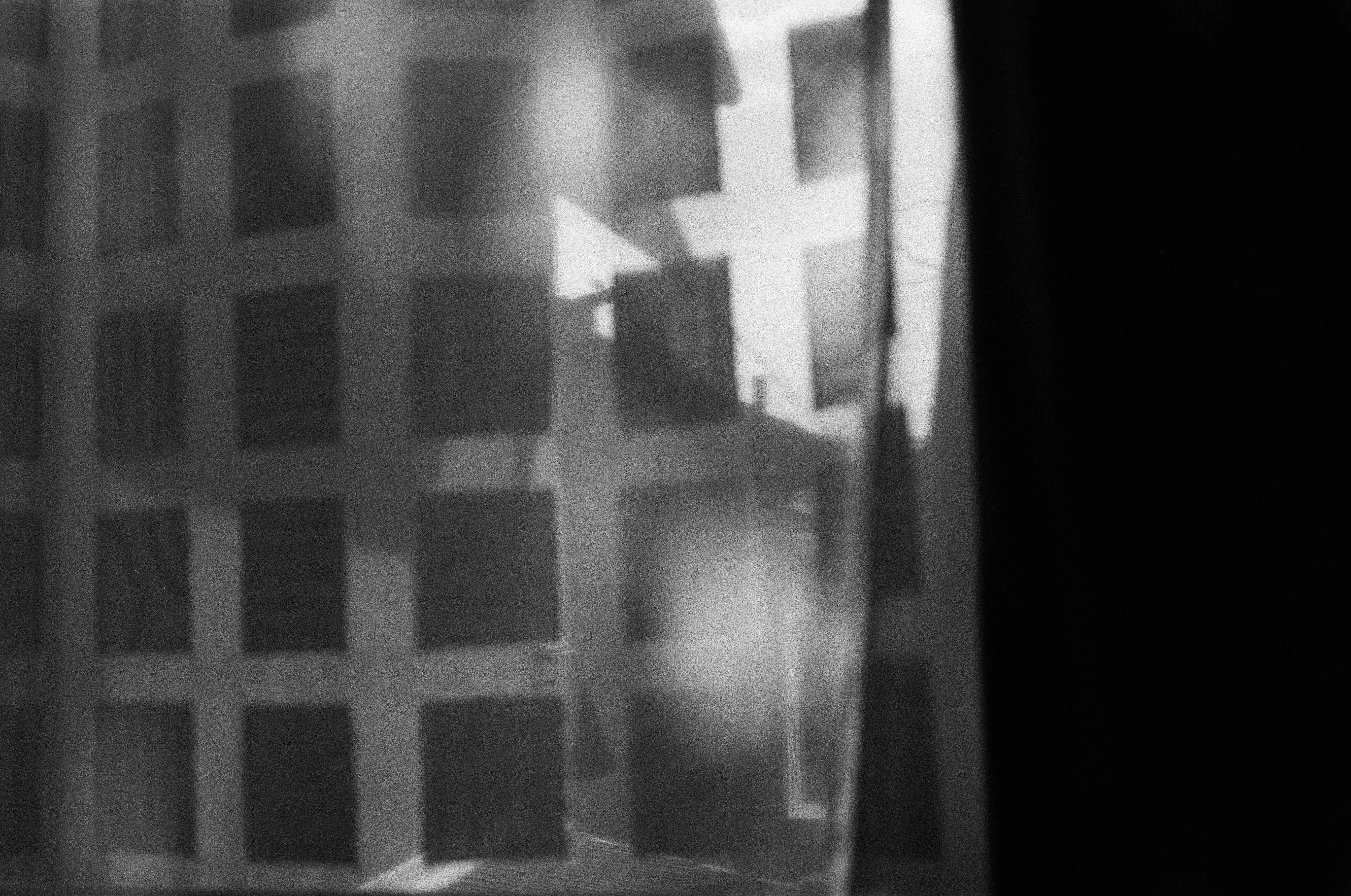 Abstract play of light on a gridded glass surface